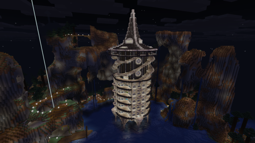 A screenshot of a minecraft build. A large cylindrical tower is nestled in the middle of a bay surrounded by extreme mountains on all sides. The building is split into 4 distinct levels. From bottom to top: a series of pillars and arches extending out of the water, 5 stories of item sorting rooms which are barely visible from this angle, a tower section with spiral staircases, and finally a ring and pointy roof with lights on it